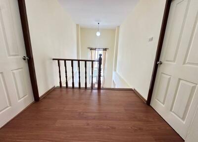 Upstairs hallway with wooden floor