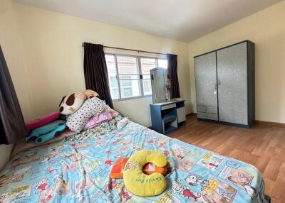 Cozy bedroom with plush toys and large wardrobe