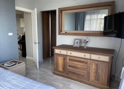 Bedroom with cabinet and mirror