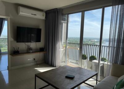 Modern living room with large windows and a scenic view