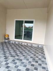 Balcony with sliding glass door and tiled flooring