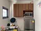 Compact modern kitchen with stainless steel appliances