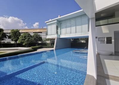 Modern building with swimming pool and relaxing area