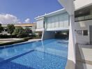 Modern building with swimming pool and relaxing area