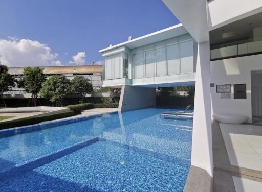 Modern building with swimming pool and relaxing area