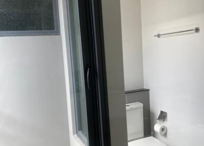 Modern bathroom with window and toilet