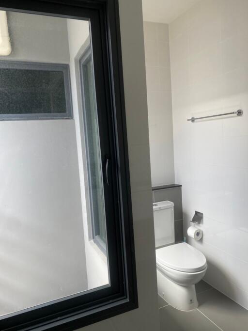 Modern bathroom with window and toilet