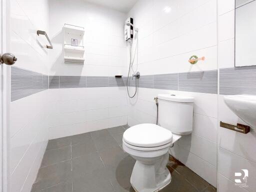 Modern bathroom with white and gray tile accents