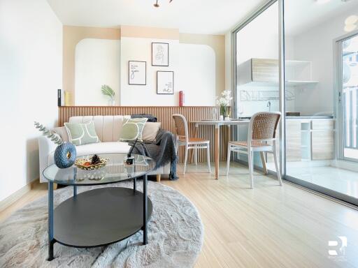 Modern living room with adjoining kitchen area