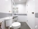 Modern bathroom with white tiles and fixtures