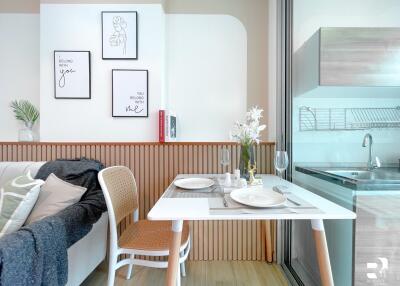 Image of a cozy dining area adjacent to a modern kitchen