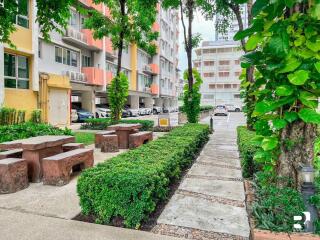 pathway and outdoor seating area next to residential building