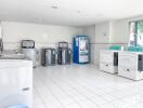 Spacious laundry room with multiple washers and dryers