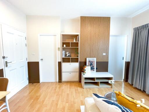 Modern living room with wooden flooring and minimalist decor