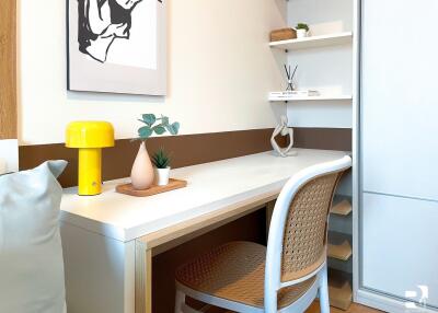 A cozy study room with a desk and decorative items