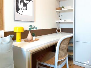 A cozy study room with a desk and decorative items