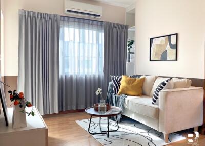 Well-lit living room with sofa and coffee table