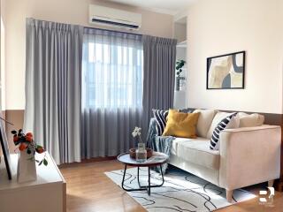 Well-lit living room with sofa and coffee table