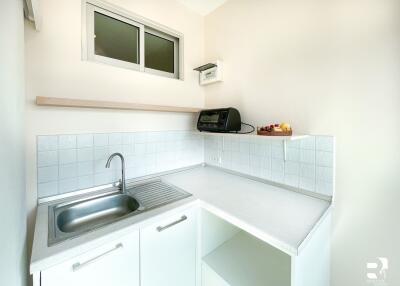 Small modern kitchen with countertop and sink