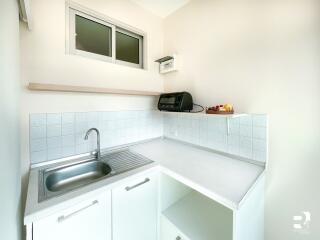 Small modern kitchen with countertop and sink