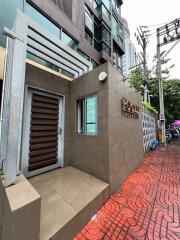 Entrance of a modern building with a tiled pathway