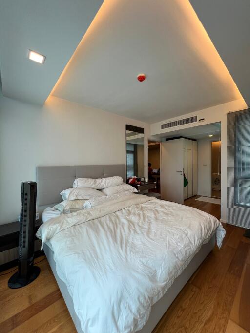 Spacious bedroom with modern lighting