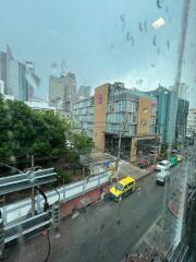 Street view of buildings on a rainy day