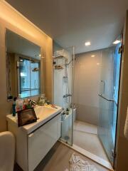 Modern bathroom with glass shower and vanity