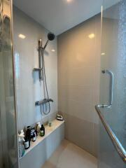 Modern bathroom with shower and toiletries