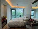 Modern bedroom with large window and cozy lighting