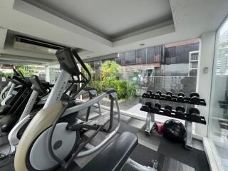 Modern gym with exercise equipment and weights