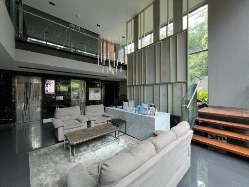 Modern lobby with seating area and reception desk