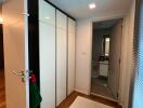 Modern bedroom with wardrobe and en-suite bathroom