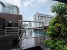 view of swimming pool area with city buildings in the background