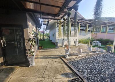 Outdoor area with garden and paved path