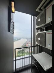 Balcony with river view and air conditioning units