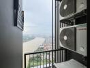 Balcony with river view and air conditioning units