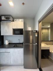 Modern kitchen with adjoining bathroom