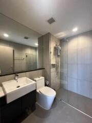 Modern bathroom with large mirror and shower