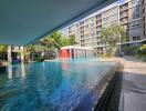 luxurious apartment complex with swimming pool and landscaping