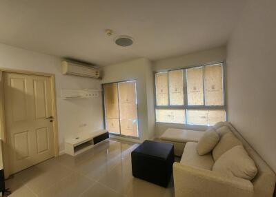 Living room with air conditioner and seating area