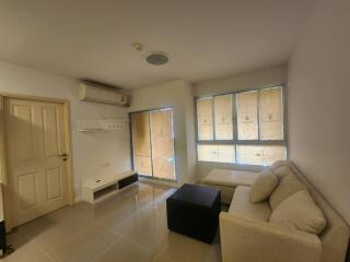 Living room with air conditioner and seating area