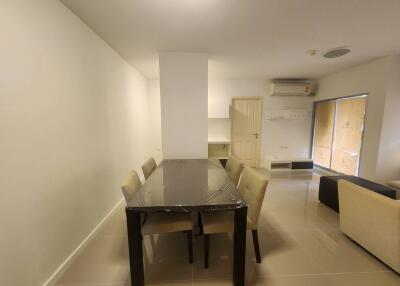 Modern dining space with a table and six chairs