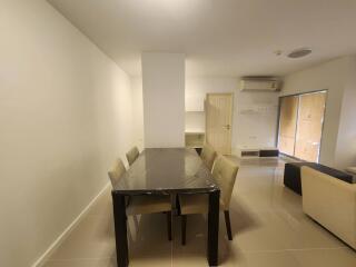 Modern dining space with a table and six chairs