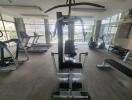 A well-equipped fitness room with a variety of exercise machines.