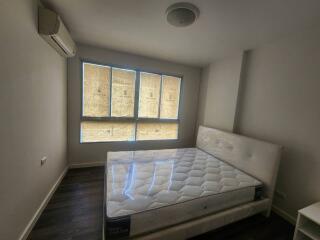 Bedroom with bed and large window