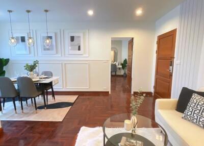 A well-lit living room with dining area