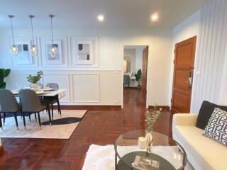 A well-lit living room with dining area