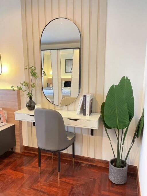 Modern bedroom with makeup table and indoor plant