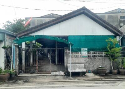 Front view of a single-story house with front yard